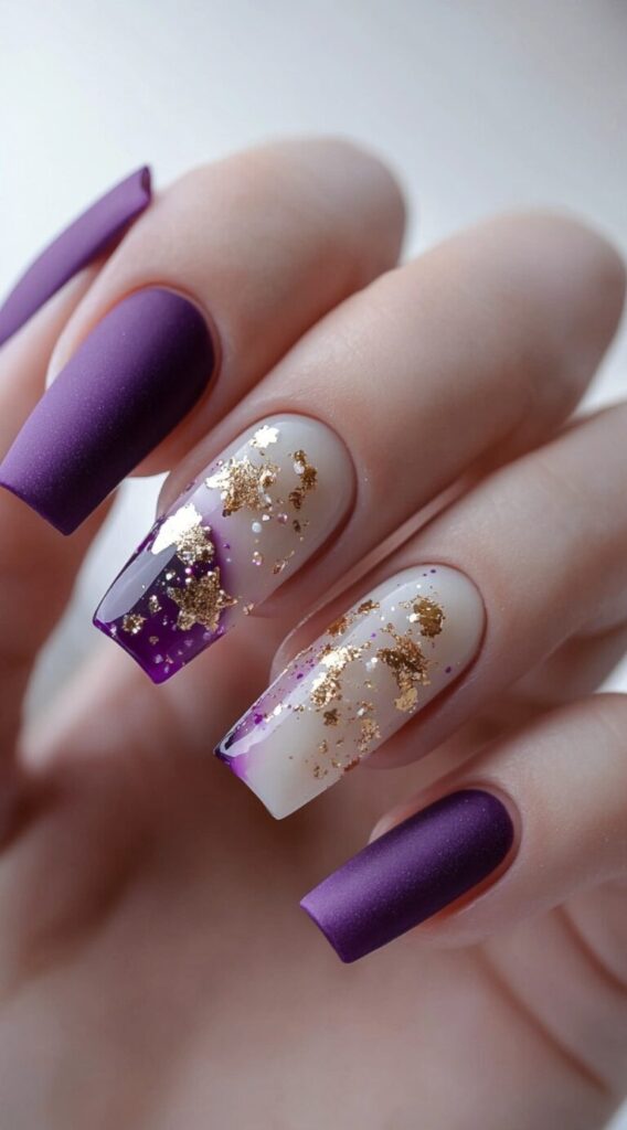 Long square nails alternating between matte purple and sheer clear tips with gold foil and purple glitter detail.